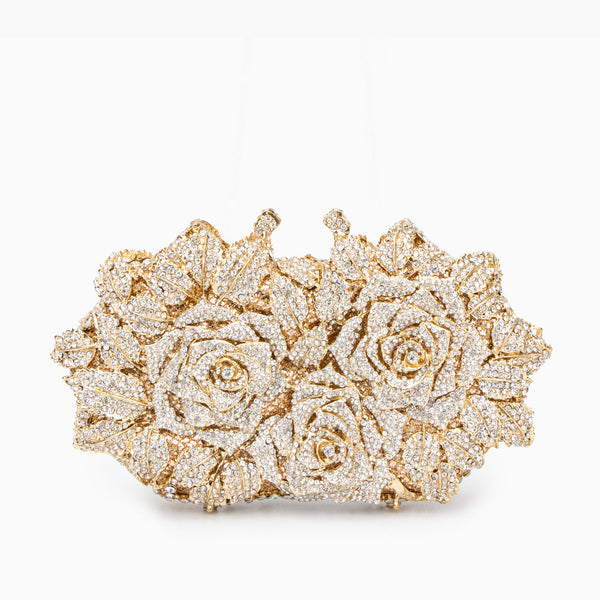 Gold clutch with diamond-studded floral design on a white background